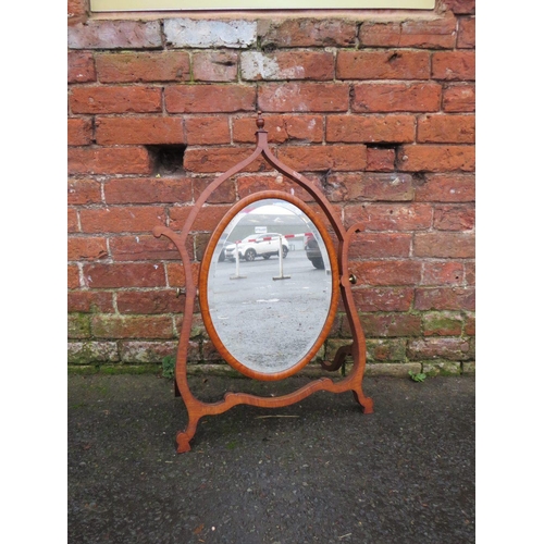 593 - A LATE 19TH CENTURY MAHOGANY DRESSING MIRROR, the oval mirror supported on a shaped framed, H 76 cm