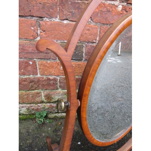 593 - A LATE 19TH CENTURY MAHOGANY DRESSING MIRROR, the oval mirror supported on a shaped framed, H 76 cm