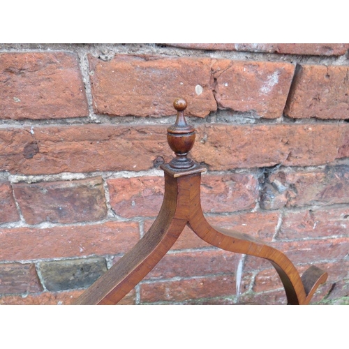 593 - A LATE 19TH CENTURY MAHOGANY DRESSING MIRROR, the oval mirror supported on a shaped framed, H 76 cm