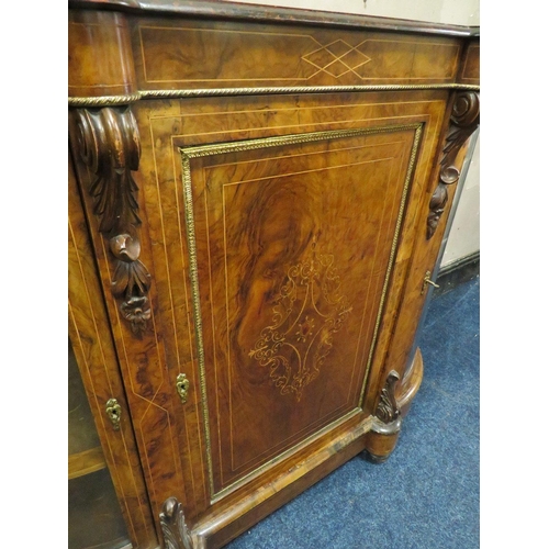 606 - A VICTORIAN WALNUT CREDENZA, having a central inlaid single door flanked by two arched glass cabinet... 