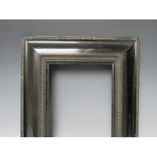 63 - A 19TH CENTURY EBONISED DUTCH FRAME, frame W 8.5 cm, rebate 20 x 25 cm