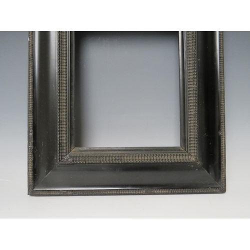 63 - A 19TH CENTURY EBONISED DUTCH FRAME, frame W 8.5 cm, rebate 20 x 25 cm