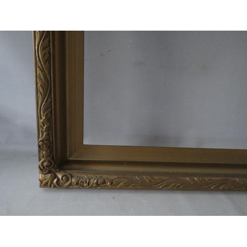 64 - AN EARLY 20TH CENTURY GOLD FRAME WITH LEAF DESIGN TO OUTER EDGE, frame W 8.5 cm, rebate 92 x 61 cm, ... 