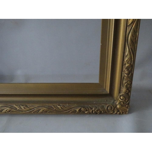 64 - AN EARLY 20TH CENTURY GOLD FRAME WITH LEAF DESIGN TO OUTER EDGE, frame W 8.5 cm, rebate 92 x 61 cm, ... 