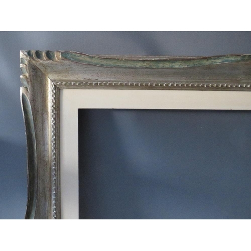 65 - A 20TH CENTURY CARVED WOODEN SILVERED FRAME WITH PAINTED SLIP, frame W 8 cm, slip rebate 80 x 60 cm,... 