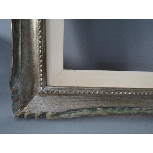 65 - A 20TH CENTURY CARVED WOODEN SILVERED FRAME WITH PAINTED SLIP, frame W 8 cm, slip rebate 80 x 60 cm,... 