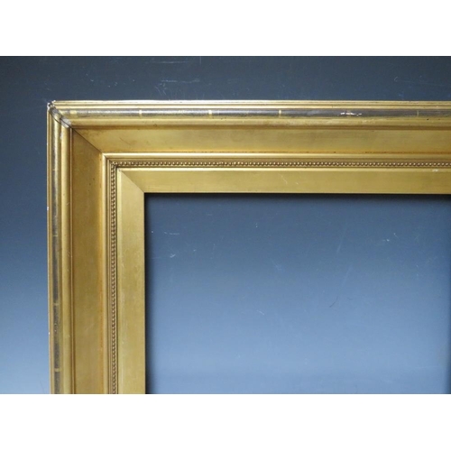 76 - A 19TH CENTURY GOLD FRAME, with gold slip and egg and dart design to inner edge, frame W 9 cm, slip ... 