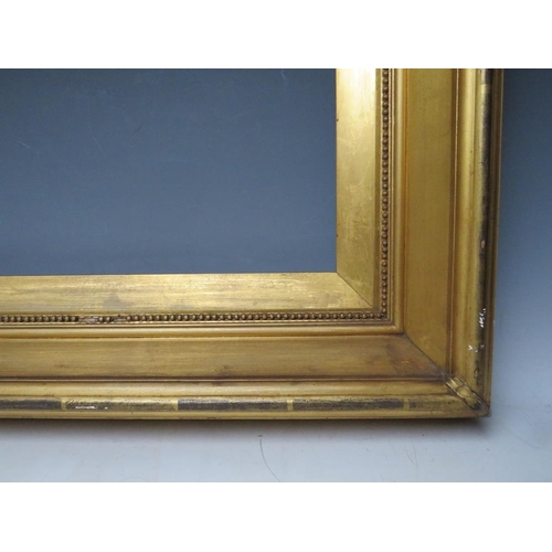 76 - A 19TH CENTURY GOLD FRAME, with gold slip and egg and dart design to inner edge, frame W 9 cm, slip ... 