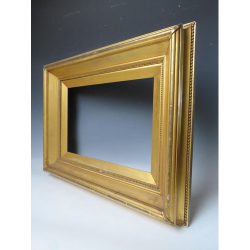 76 - A 19TH CENTURY GOLD FRAME, with gold slip and egg and dart design to inner edge, frame W 9 cm, slip ... 