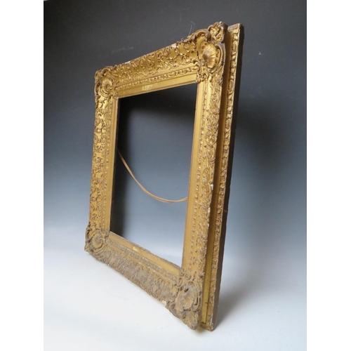 78 - AN 18TH CENTURY DECORATIVE GOLD FRAME WITH CORNER EMBELLISHMENTS, frame W 10 cm, frame rebate 47 x 3... 