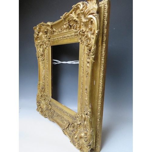 80 - A LATE 18TH / EARLY 19TH CENTURY GOLD SWEPT FRAME, frame W 16 cm, frame rebate 42 x 33 cm