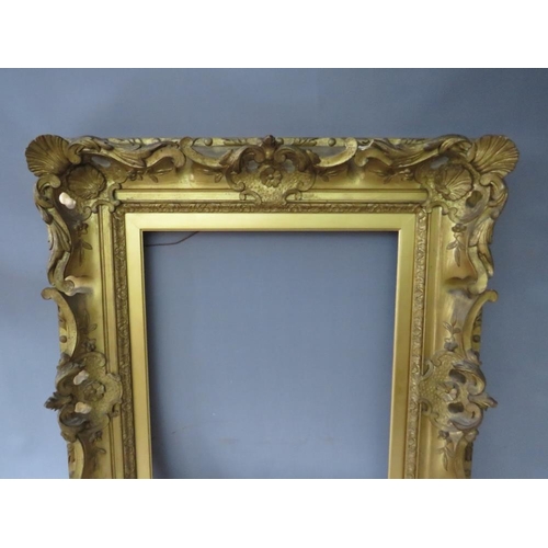 81 - A 19TH CENTURY DECORATIVE GOLD SWEPT FRAME, with gold slip, frame W 10.5 cm, slip rebate 51 x 41 cm,... 