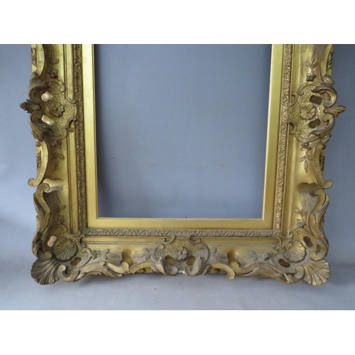 81 - A 19TH CENTURY DECORATIVE GOLD SWEPT FRAME, with gold slip, frame W 10.5 cm, slip rebate 51 x 41 cm,... 