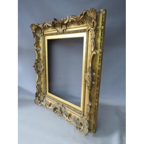 81 - A 19TH CENTURY DECORATIVE GOLD SWEPT FRAME, with gold slip, frame W 10.5 cm, slip rebate 51 x 41 cm,... 