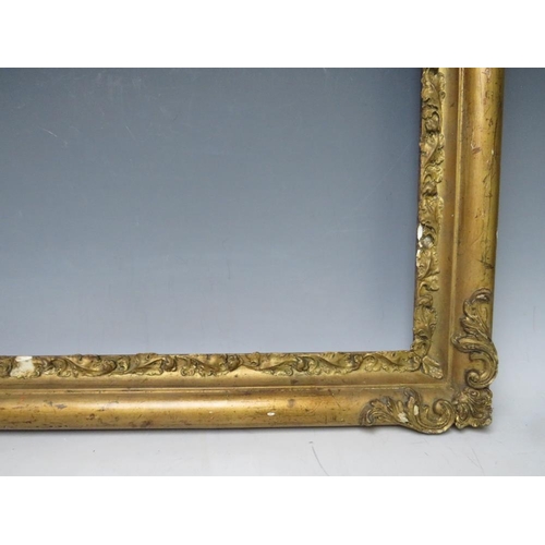 83 - A LATE 18TH / EARLY 19TH CENTURY GOLD FRAME WITH CORNER EMBELLISHMENTS, leaf design to inner edge, f... 