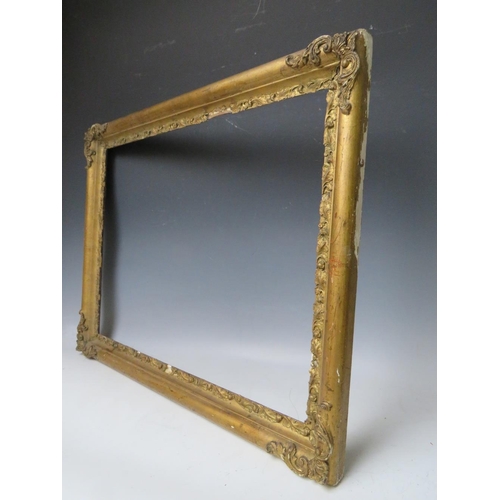 83 - A LATE 18TH / EARLY 19TH CENTURY GOLD FRAME WITH CORNER EMBELLISHMENTS, leaf design to inner edge, f... 