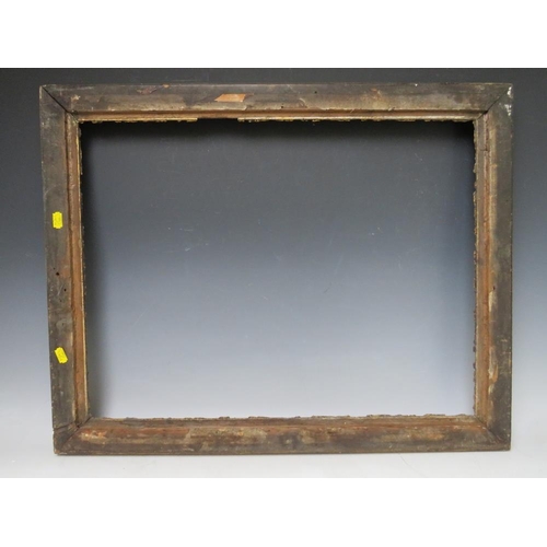 83 - A LATE 18TH / EARLY 19TH CENTURY GOLD FRAME WITH CORNER EMBELLISHMENTS, leaf design to inner edge, f... 