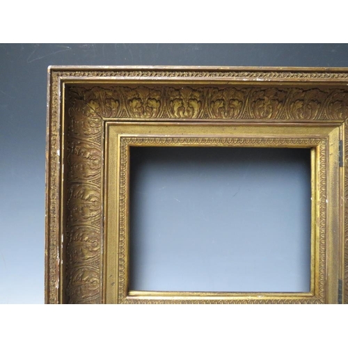 84 - AN 18TH CENTURY GOLD HINGED CABINET FRAME, with acanthus leaf design, frame W 11 cm, rebate 25 x 31 ... 