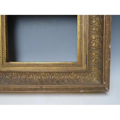 84 - AN 18TH CENTURY GOLD HINGED CABINET FRAME, with acanthus leaf design, frame W 11 cm, rebate 25 x 31 ... 