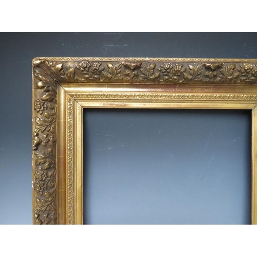 85 - A LATE 18TH / EARLY 19TH CENTURY DECORATIVE GOLD FRAME, with leaf design to outer edge, frame W 11 c... 