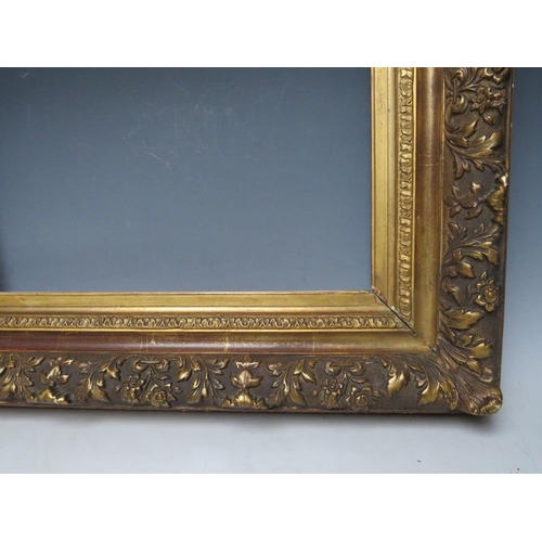 85 - A LATE 18TH / EARLY 19TH CENTURY DECORATIVE GOLD FRAME, with leaf design to outer edge, frame W 11 c... 