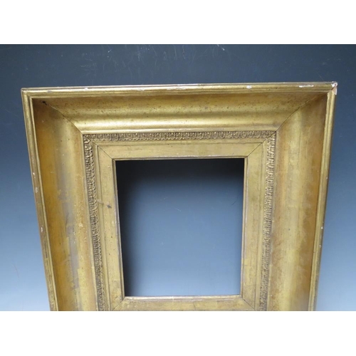 87 - AN 18TH CENTURY GOLD FRAME, with design to inner edge, frame W 10 cm, rebate 27 x 23 cm