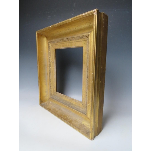 87 - AN 18TH CENTURY GOLD FRAME, with design to inner edge, frame W 10 cm, rebate 27 x 23 cm