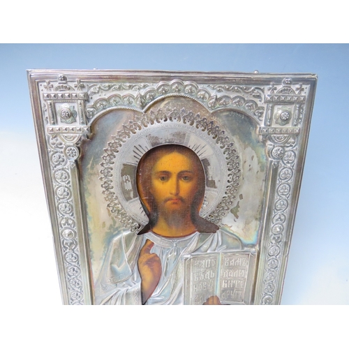 123 - A 19TH CENTURY RUSSIAN ICON WITH WHITE METAL OKLAD, inscribed verso 'To The Spiritual Leader of the ... 