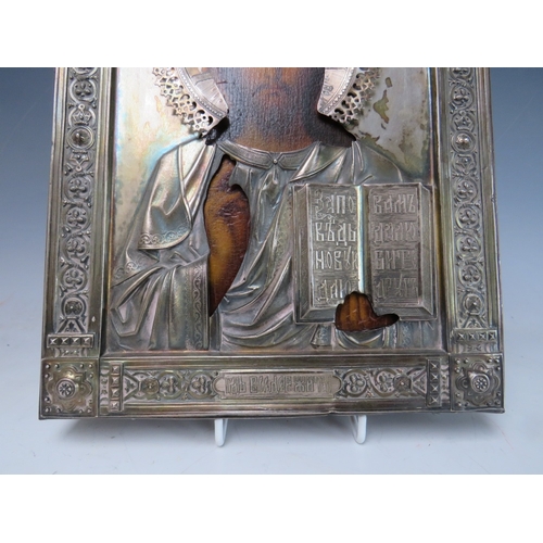 123 - A 19TH CENTURY RUSSIAN ICON WITH WHITE METAL OKLAD, inscribed verso 'To The Spiritual Leader of the ... 