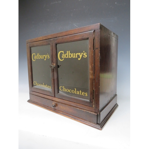 477 - A LATE 19TH / EARLY 20TH CENTURY DISPLAY CABINET, with drawer to base and two glazed doors, the lett... 