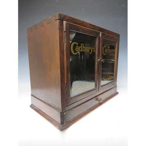 477 - A LATE 19TH / EARLY 20TH CENTURY DISPLAY CABINET, with drawer to base and two glazed doors, the lett... 