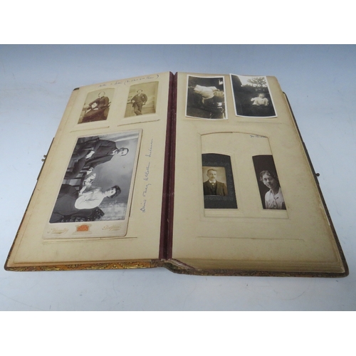 527 - A PHOTOGRAPH ALBUM DATED 1916 ON INNER COVER, with mixed media painting of a young woman in classica... 