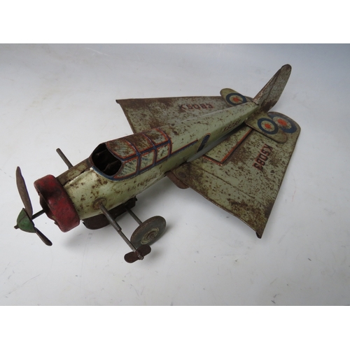 546 - A VINTAGE CLOCKWORK TIN PLATE PROPELLER AEROPLANE, with retractable wings, L 30 cm, W 43 cm with win... 