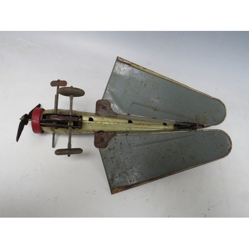 546 - A VINTAGE CLOCKWORK TIN PLATE PROPELLER AEROPLANE, with retractable wings, L 30 cm, W 43 cm with win... 