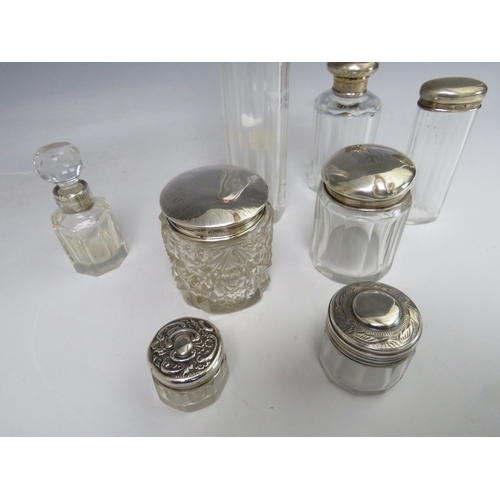 196 - A COLLECTION OF HALLMARKED SILVER LIDDED VANITY JARS, tallest H 16 cm, together with a small silver ... 