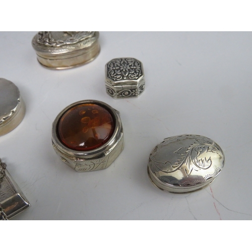 198 - A COLLECTION OF NINE HALLMARKED SILVER AND 925 PILL BOXES, to include a handbag shaped example and a... 