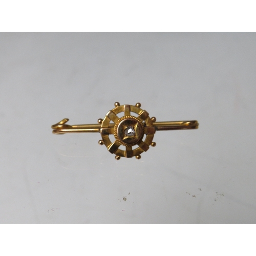 228 - A HALLMARKED 9CT GOLD DIAMOND SET BAR BROOCH, together with a starburst style brooch stamped 9ct (co... 