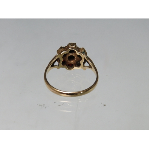 248 - A HALLMARKED 9CT GOLD FLORAL CLUSTER DRESS RING, set with garnet type gemstones, ring size R, approx... 