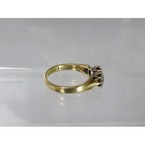 250 - AN 18CT GOLD DRESS RING, with two illusion set diamonds to central crossover type mount, ring size O... 