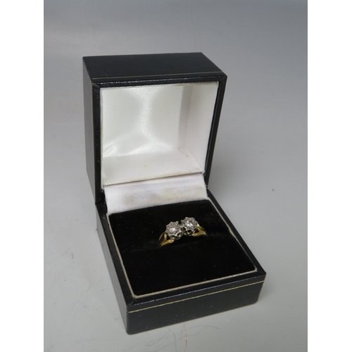 250 - AN 18CT GOLD DRESS RING, with two illusion set diamonds to central crossover type mount, ring size O... 