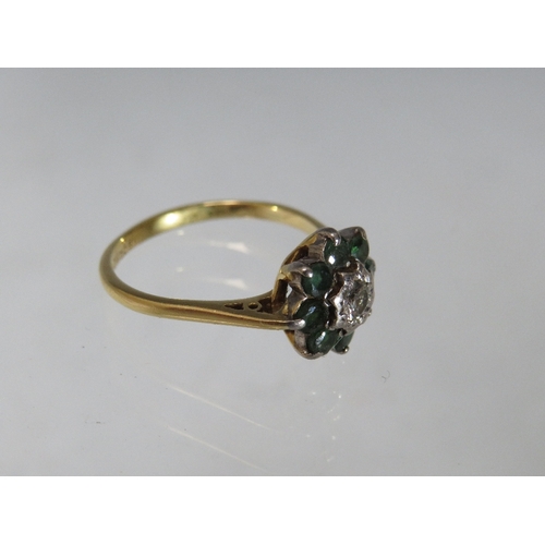 251 - AN 18CT GOLD EMERALD AND DIAMOND CLUSTER DRESS RING, ring size Q, approximately 3.85 g