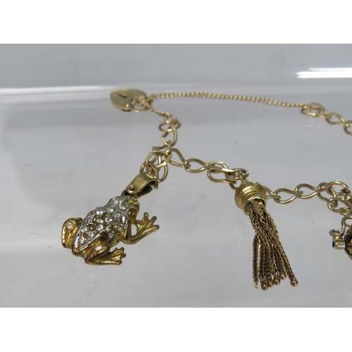 267 - A 9CT GOLD CHARM BRACELET AND CHARMS, some charms unmarked, approximate overall weight 17.8 g