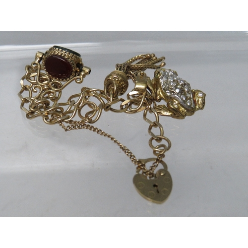 267 - A 9CT GOLD CHARM BRACELET AND CHARMS, some charms unmarked, approximate overall weight 17.8 g