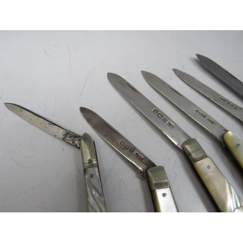 203 - A COLLECTION OF MOTHER OF PEARL HANDLED FRUIT / PENKNIVES, to include four hallmarked silver bladed ... 