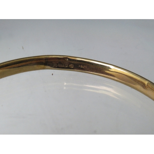 222 - A CHESTER HALLMARKED 9CT GOLD BANGLE, internal Dia. 7 cm