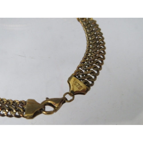 223 - A GILT METAL SNAKE ARM BANGLE, together with a decorative link bracelet stamped 925 and a 9ct gold f... 