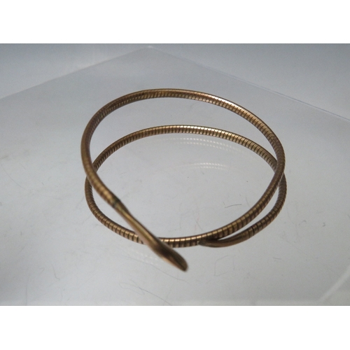 223 - A GILT METAL SNAKE ARM BANGLE, together with a decorative link bracelet stamped 925 and a 9ct gold f... 