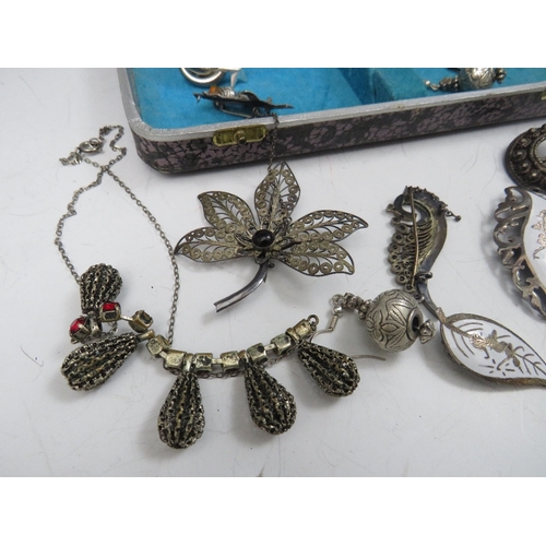 243 - A COLLECTION OF VINTAGE SILVER AND WHITE METAL COSTUME JEWELLERY, to include a Siam silver brooch an... 