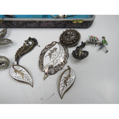 243 - A COLLECTION OF VINTAGE SILVER AND WHITE METAL COSTUME JEWELLERY, to include a Siam silver brooch an... 