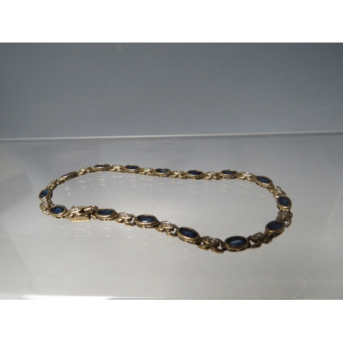 232 - A 9CT  GOLD SAPPHIRE AND DIAMOND SET BRACELET, approximately 6.7 g